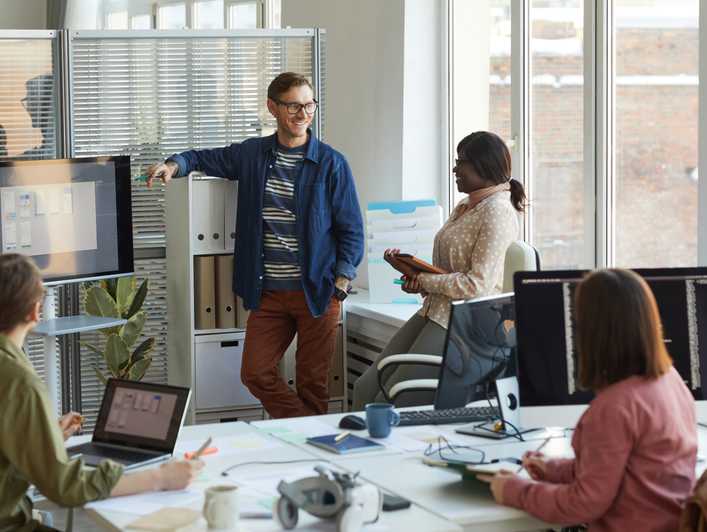Two colleagues talking in an office